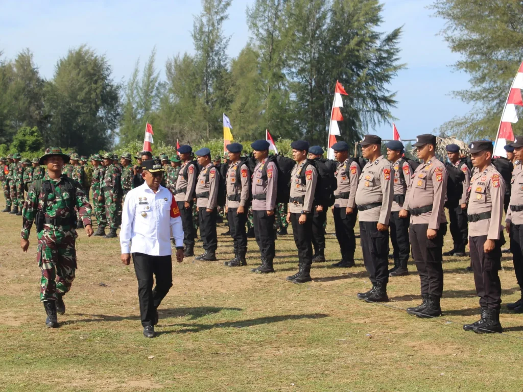 Foto: Pj. Bupati Aceh Jaya, Dr. A. Murtala, M.Si., Bertindak Sebagai Inspektur pada Upacara Pembukaan TMMD Reguler Ke-121 TA 2024 Kodim 0114/Aceh Jaya.